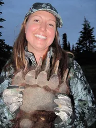 Hunter with a harvested black bear
