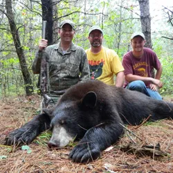 Hunter with a harvested black bear