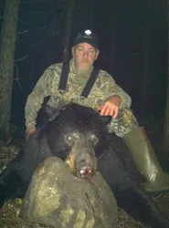 Hunter with a harvested black bear