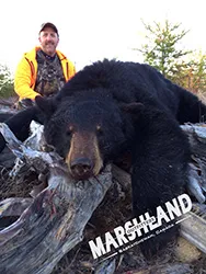 Hunter with a harvested black bear