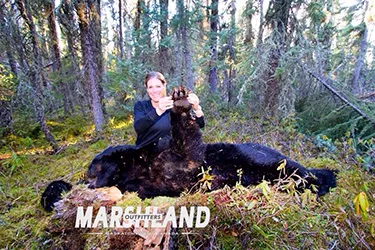 Hunter with a harvested black bear