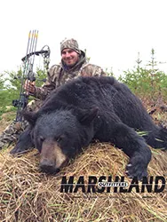 Hunter with a harvested black bear