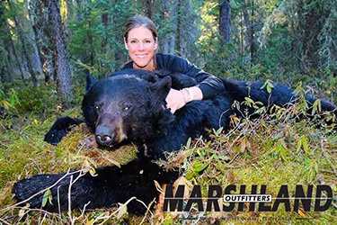 Hunter with a harvested black bear