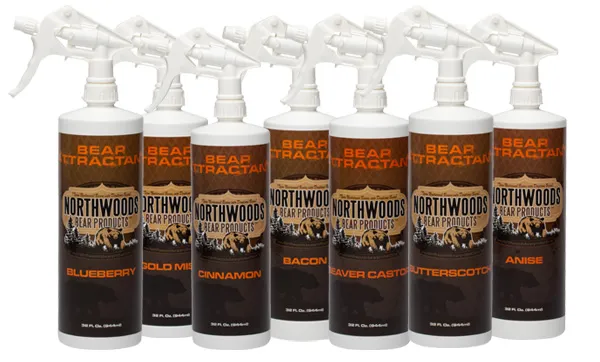 Seven 32 oz. bottles of Northwoods spray scent in a row
